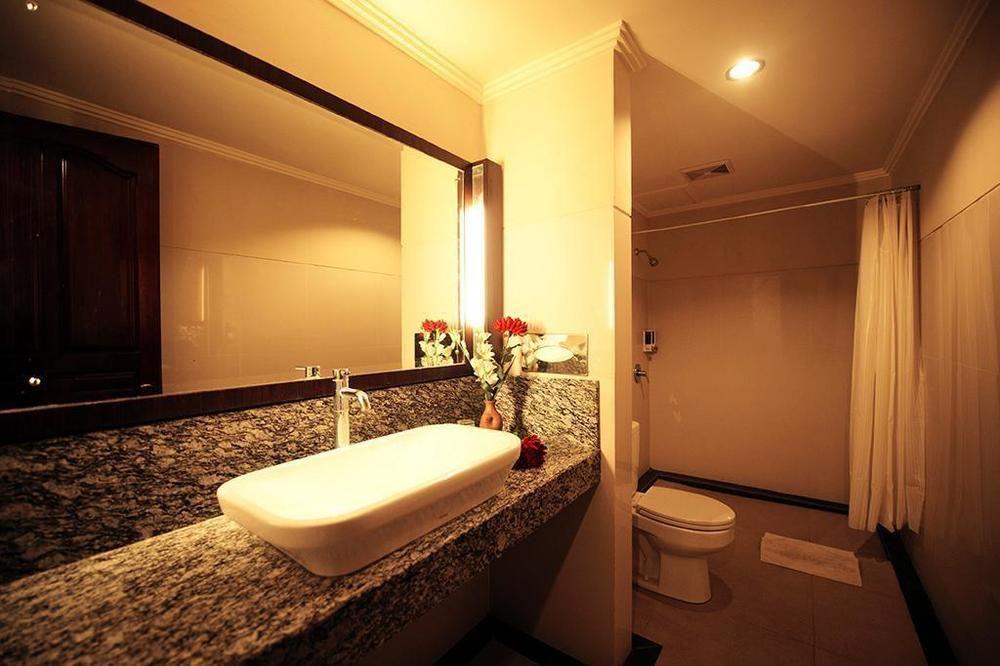 Urbanview Hotel Taman Suci Denpasar Værelse billede