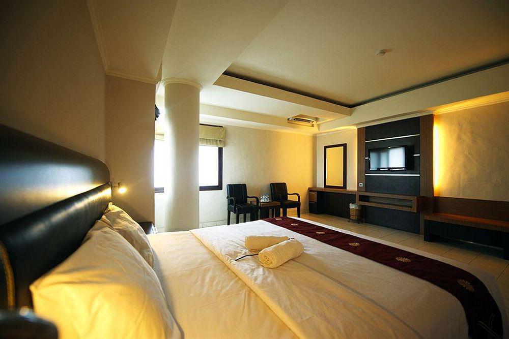 Urbanview Hotel Taman Suci Denpasar Værelse billede